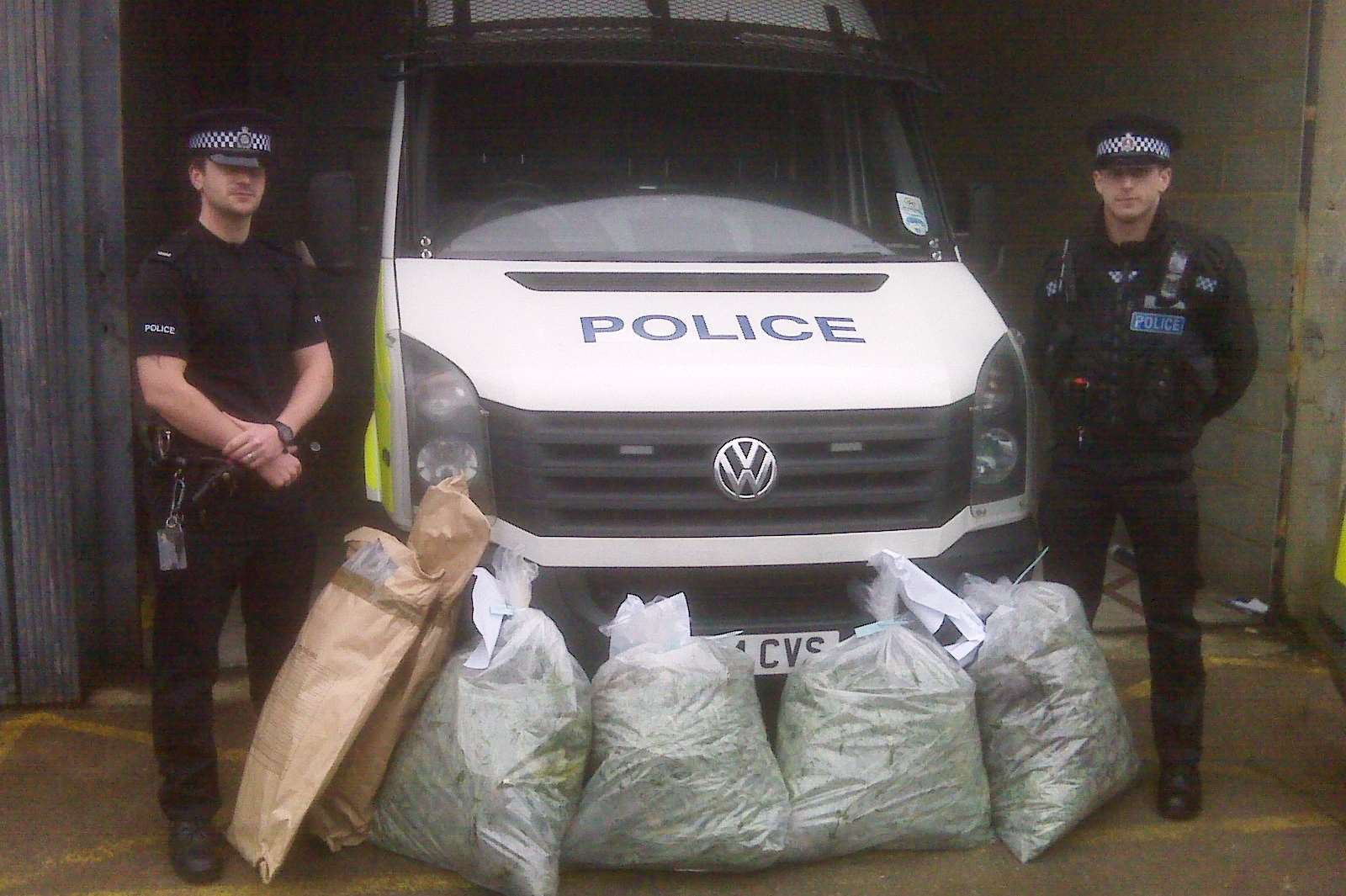 PCs Dan Toner and Ashley Moore with the seized cannabis plants