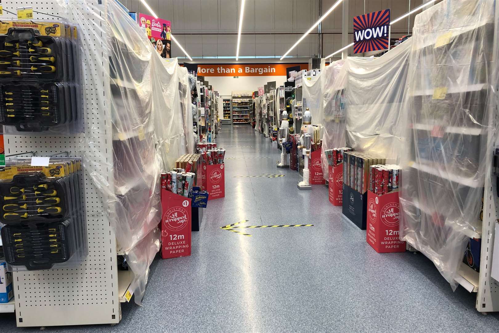 Aisles of “non-essential” items have been cordoned off in shops as part of Wales’s 17-day “firebreak” (Ben Birchall/PA)