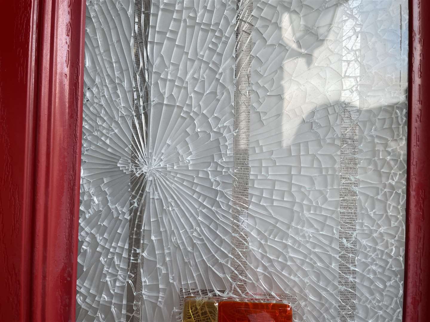 Another house has also had its door window smashed