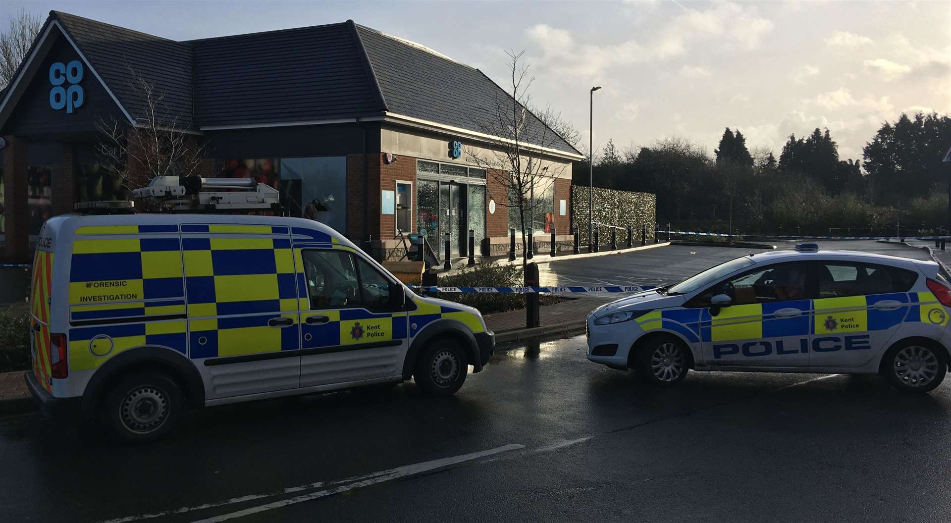 Police at the Co-op store in Harrietsham this morning