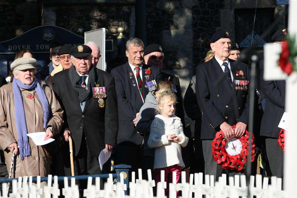 Young and old pay their tribute to those who have died in wars