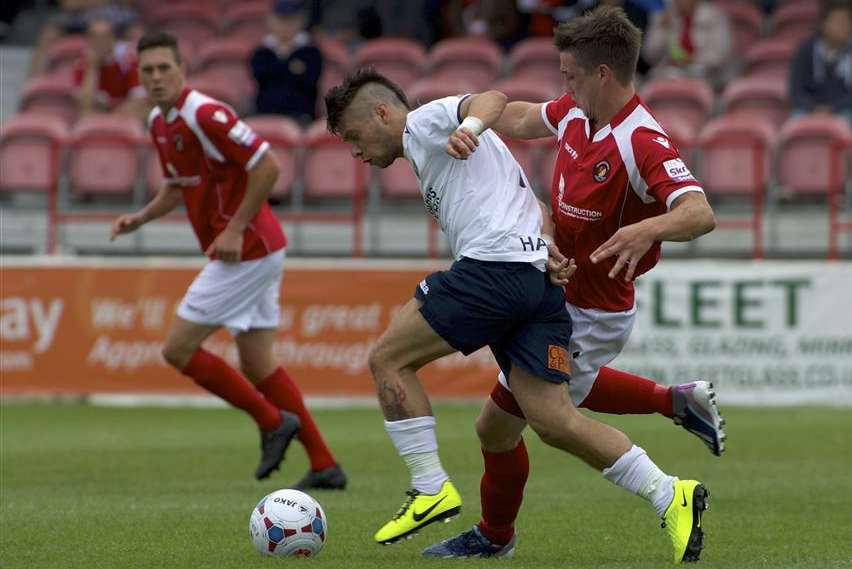 New Dover signing Christian Nanetti (white shirt) takes on the Ebbsfleet defence while playing for Havant & Waterlooville last season