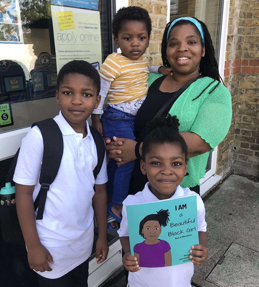 Isha Dibua with her children outside their school as they were all really proud the book is now being read in class. Picture: Isha Dibua