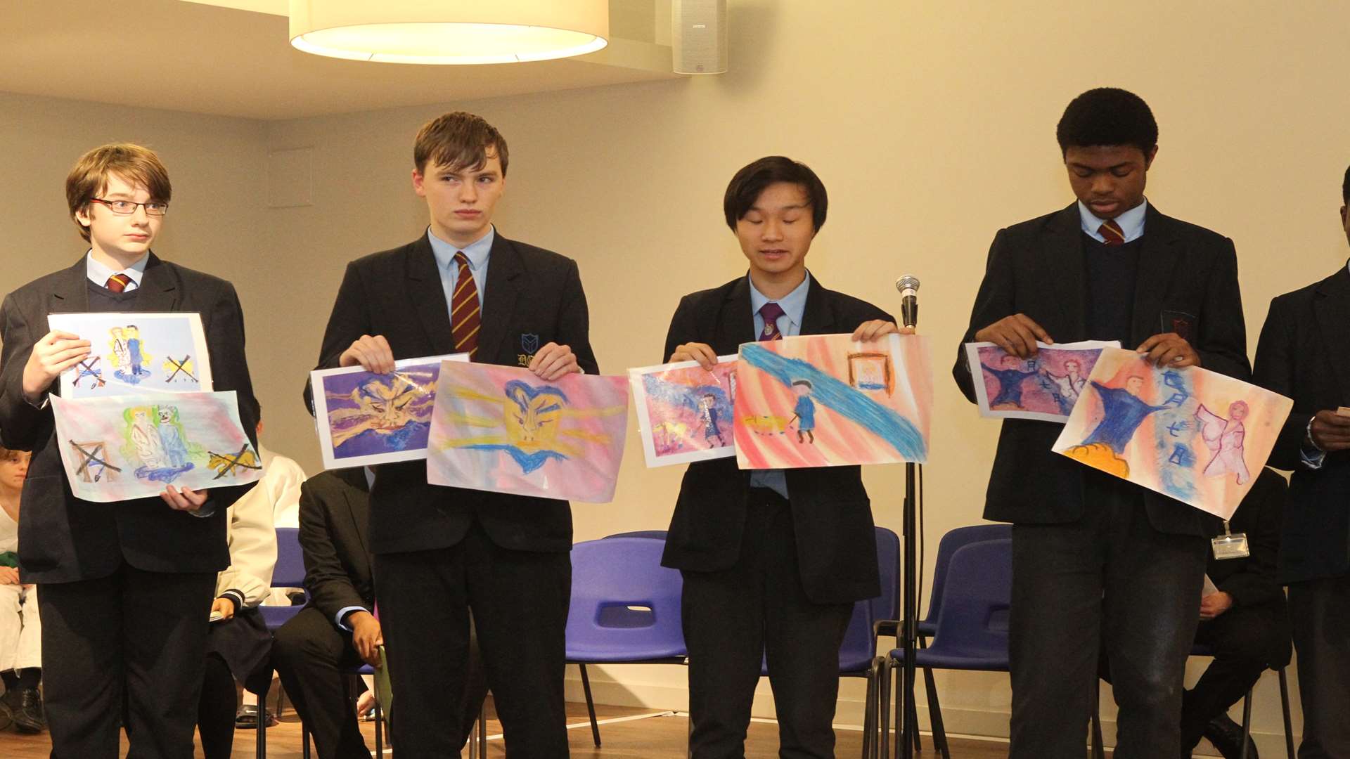 Youngsters from Dartford Grammar School show their art work as they recite haikus.