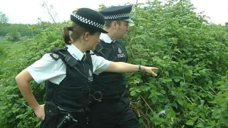 PCs Lee Duncan and Justine Frost at the spot where the dumped mail was discovered