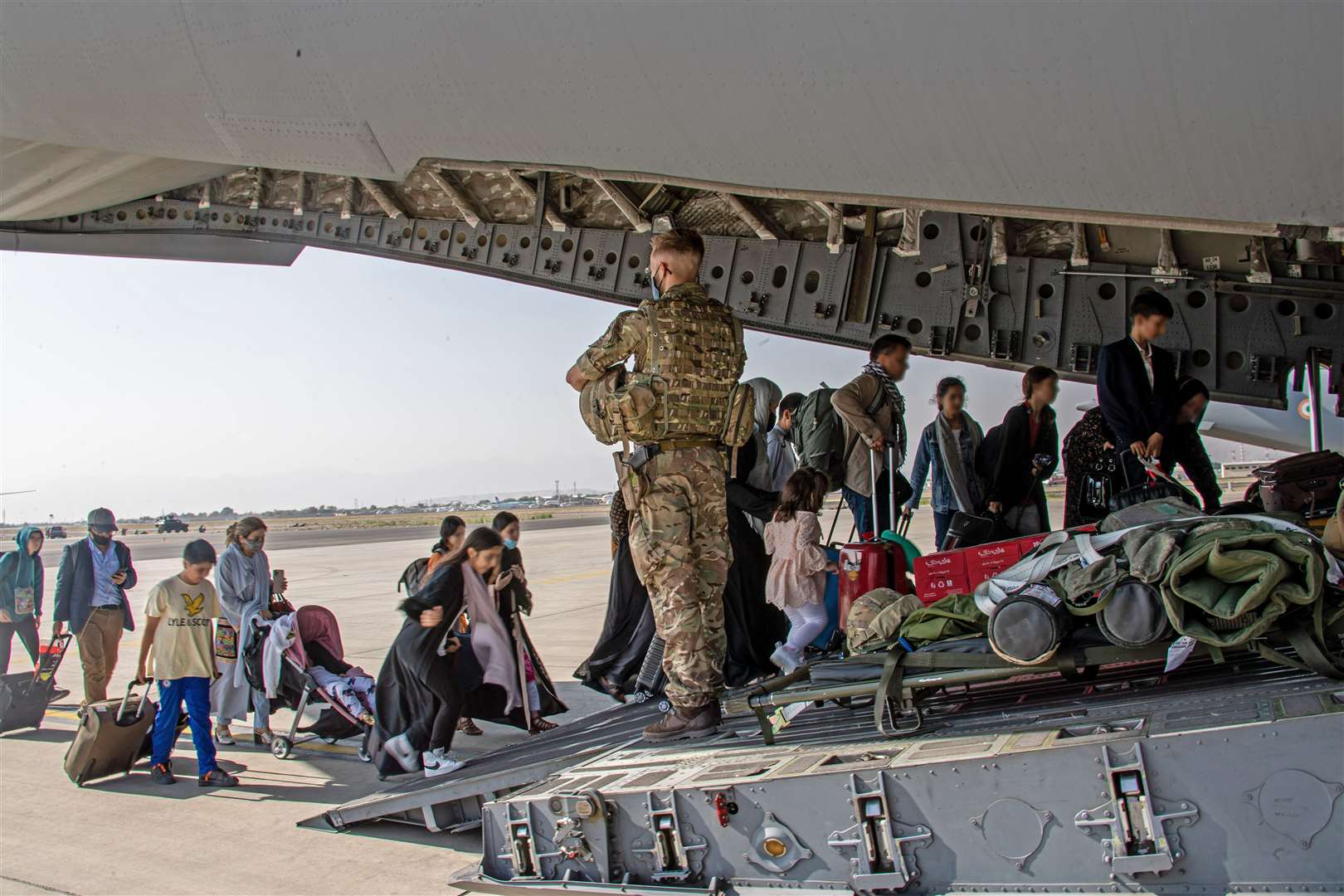 British nationals board a RAF aircraft at Kabul airport (LPhot Ben Shread/MoD/PA