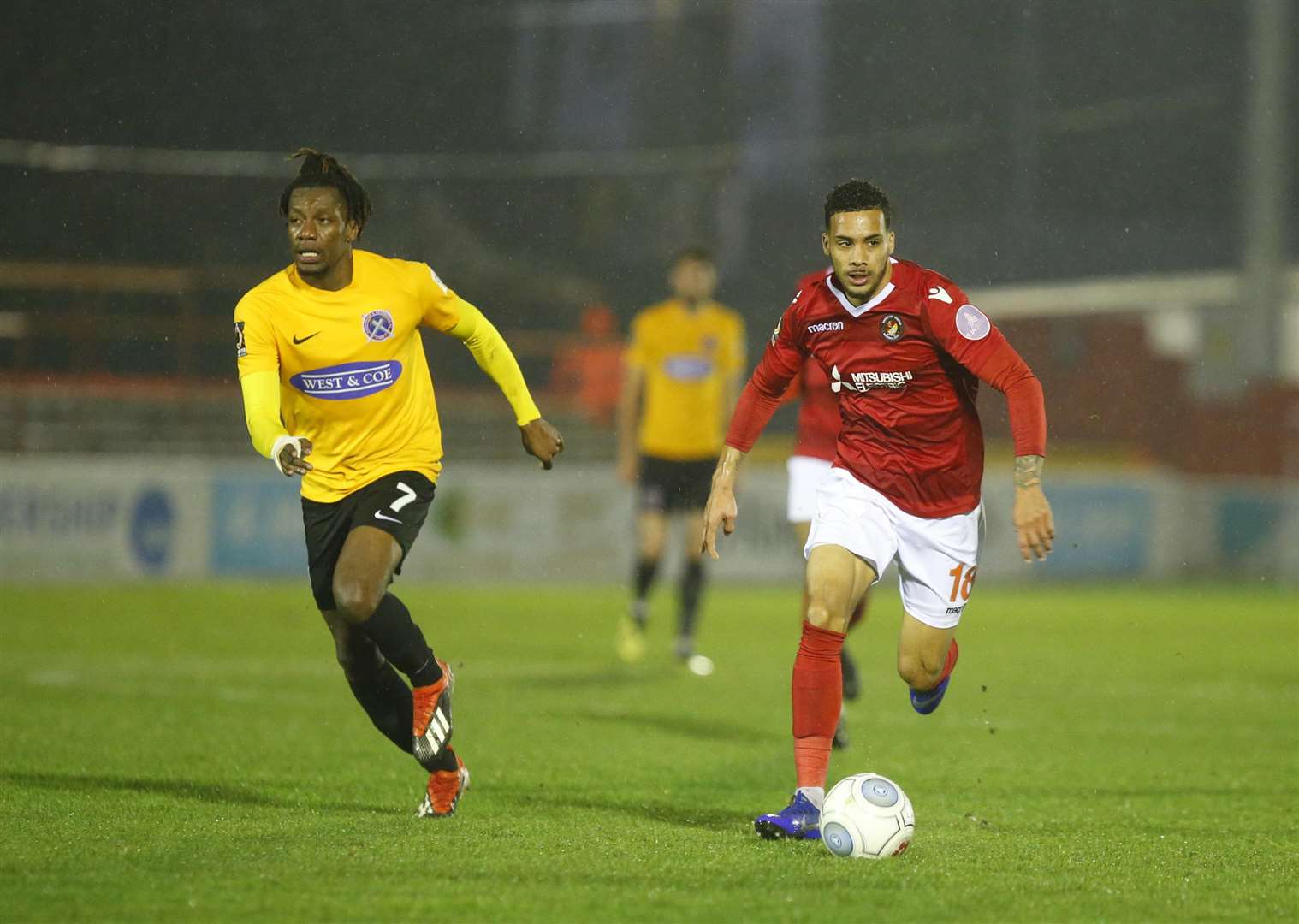 Corey Whitely runs away from Dagenham's Alex McQueen Picture: Andy Jones