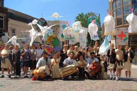 Children from St Francis Primary School and St Michael's Primary School accompany Four by Four Dhol Drummers to launch last year's festival