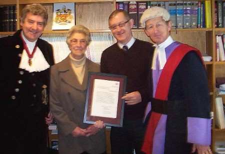 BRAVE MAN: Brian Beesley, centre right, with his mother, the High Sheriff Nigel Wheeler, and Judge Jeremy Carey. Picture courtesy MAUREEN UTTING