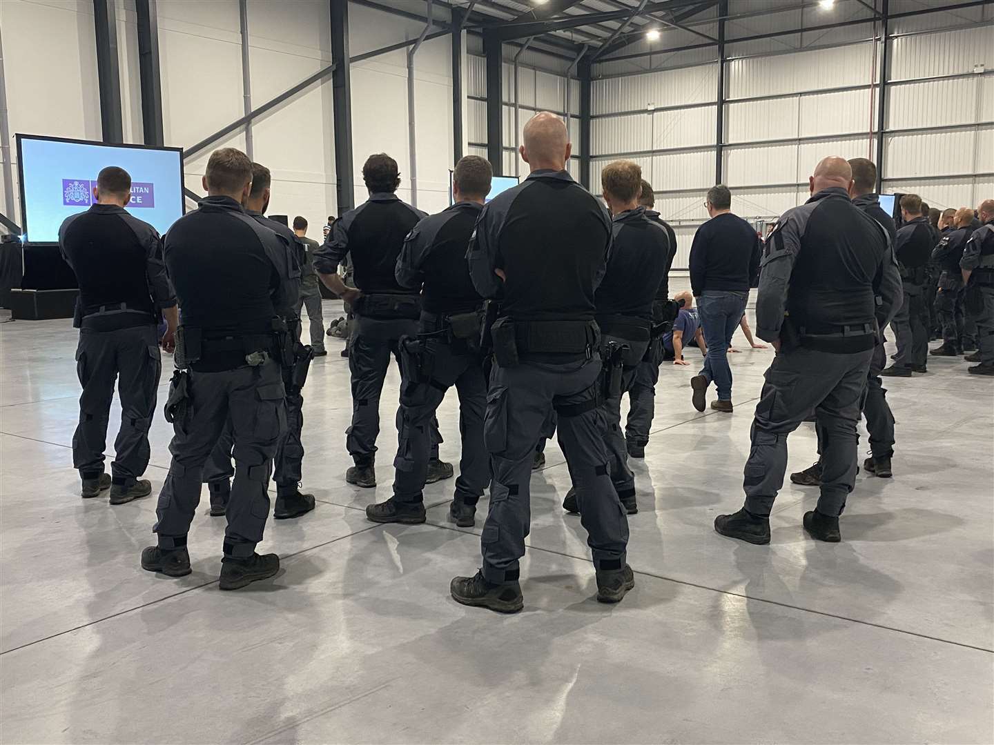 Police being briefed on the raid in Orpington. Picture: Met Police