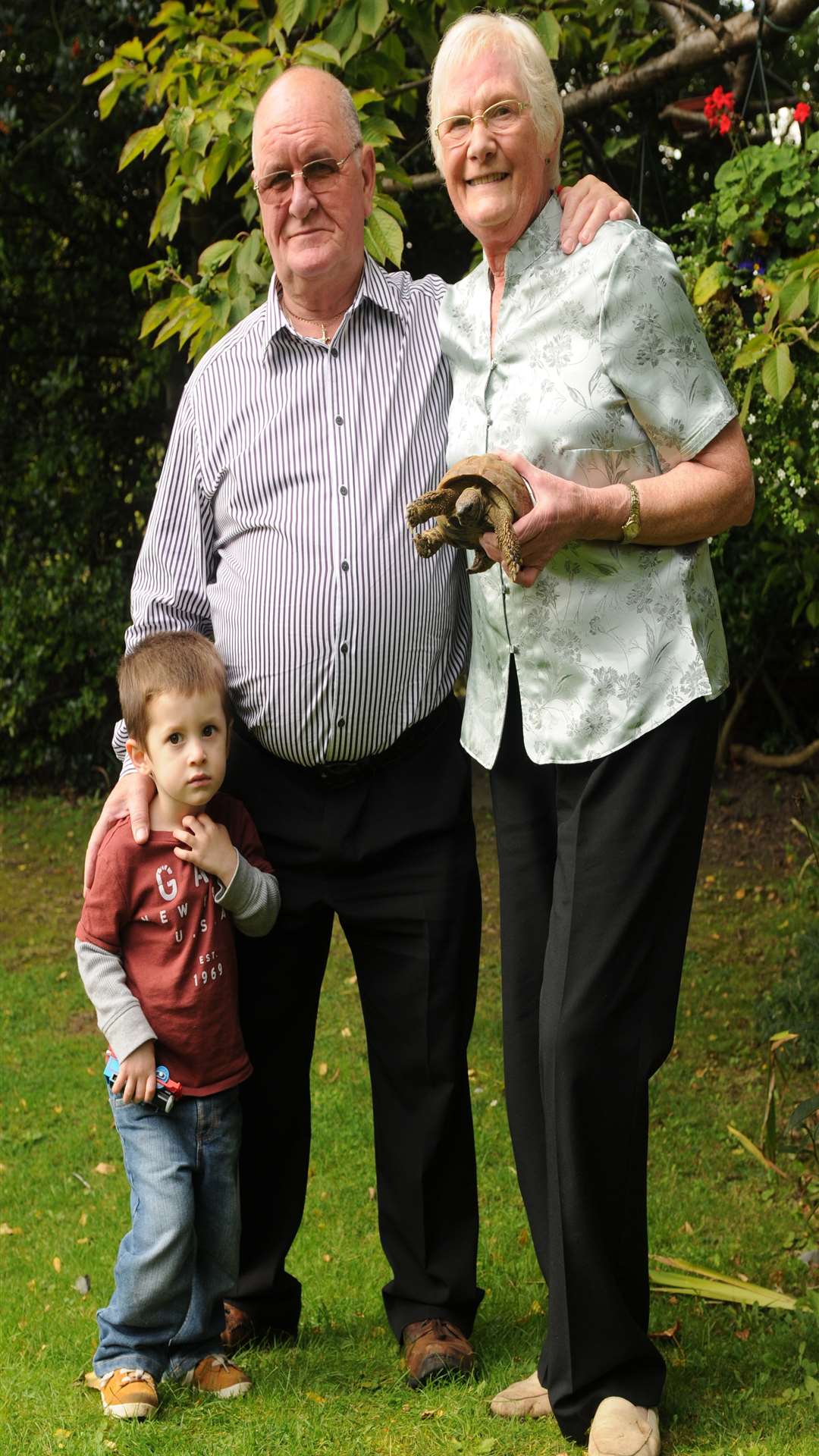 Janet and William Delahay with grandson Jacob, two, and Fred the tortoise, 32