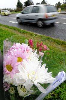 A single bouquet of flowers at the scene of a fatal collision yesterday on the old Sheppey Way, Bobbing.