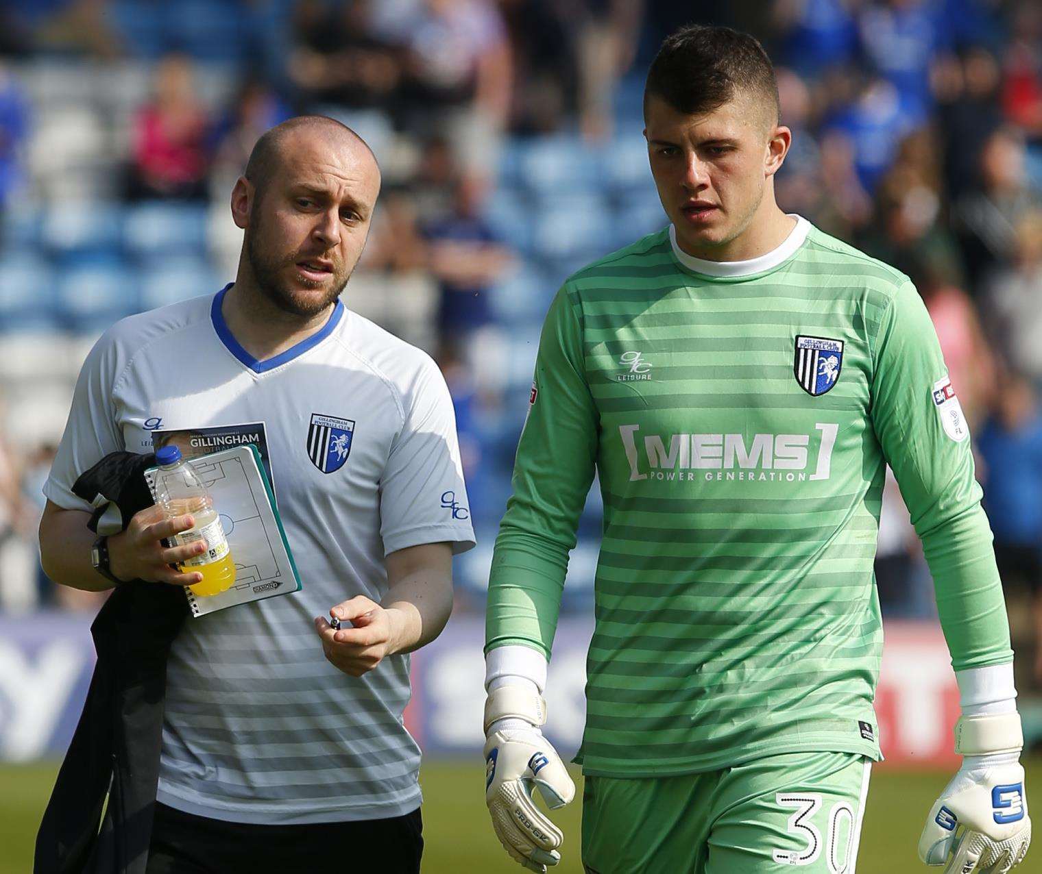 Tom Hadler with Gills goalkeeper coach Glen Johnson Picture: Andy Jones