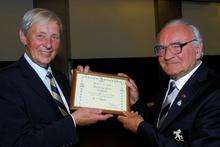 Colonel Crispin Champion, President of the QueenÃ­s Own Buffs Association, presents the Certificate of Merit to Tony Chesson, secretary of the Sittingbourne branch of the Association.
