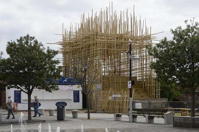 Critics claim the 'monstrous' bamboo structure dwarfs everything else and is smothering businesses