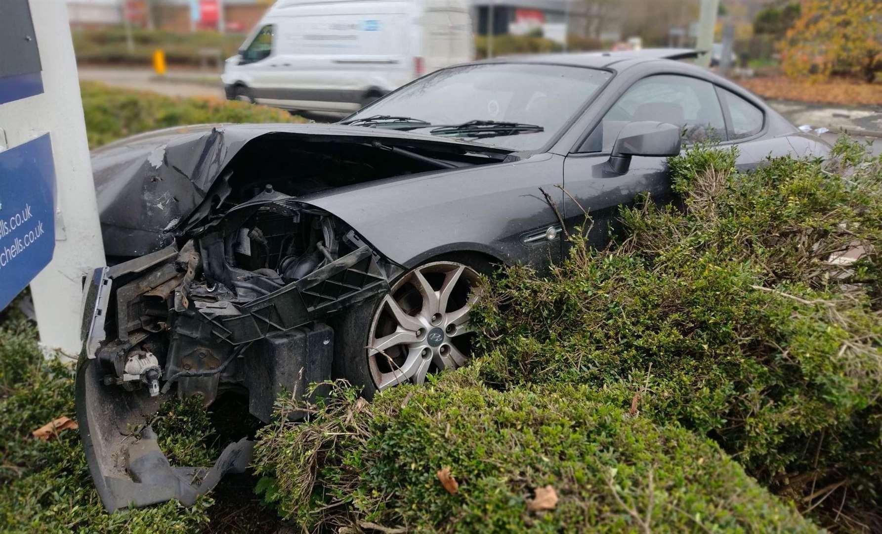 A car has crashed into a retail park sign along the A28 in Canterbury