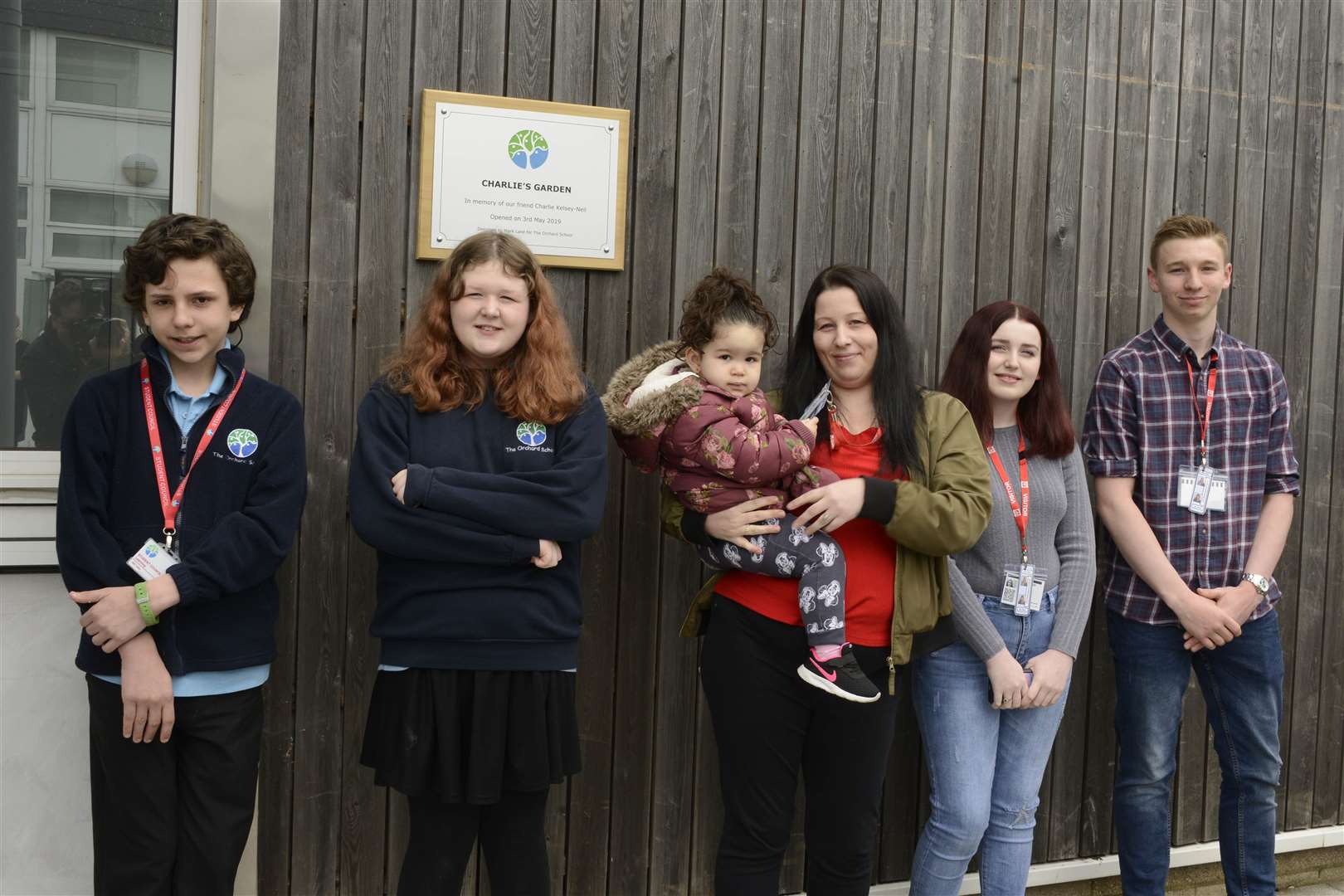 Family and pupils by the plaque. Picture: Paul Amos