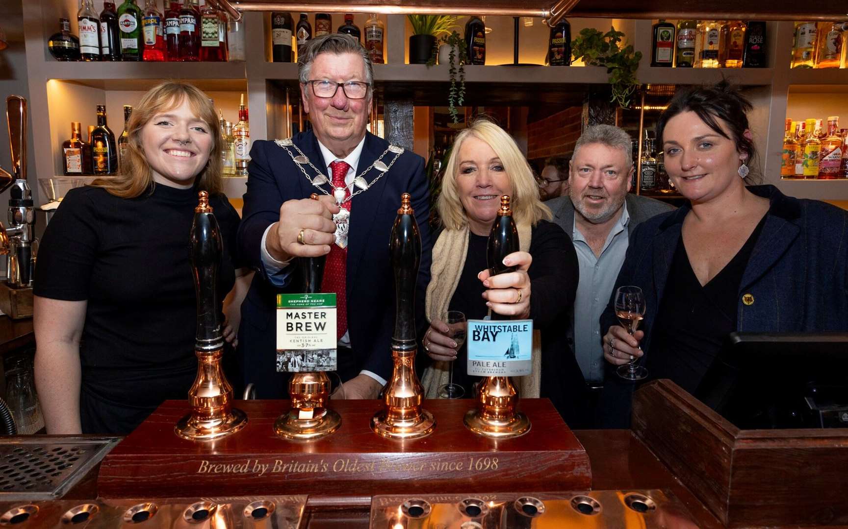The Sheriff of Canterbury Cllr Tom Mellish with the new hosts of the Woolpack at Chilham, the Thompson family