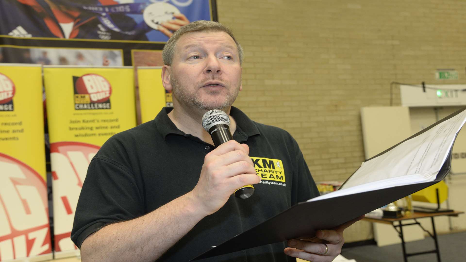 Quizmaster Simon Dolby of the KM Charity Team hosting last year's Canterbury Big Charity Quiz at the University of Kent sports hall. Booking is still open for this year's quiz staged on Friday, April 22.
