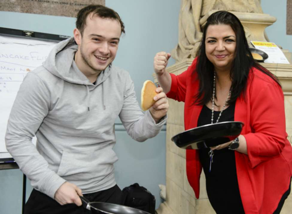 Messenger reporter, Daniel Green, beat Gravesham Borough Council's press officer, Sarah Knight, 41 to 40 in the pancake flipping contest.