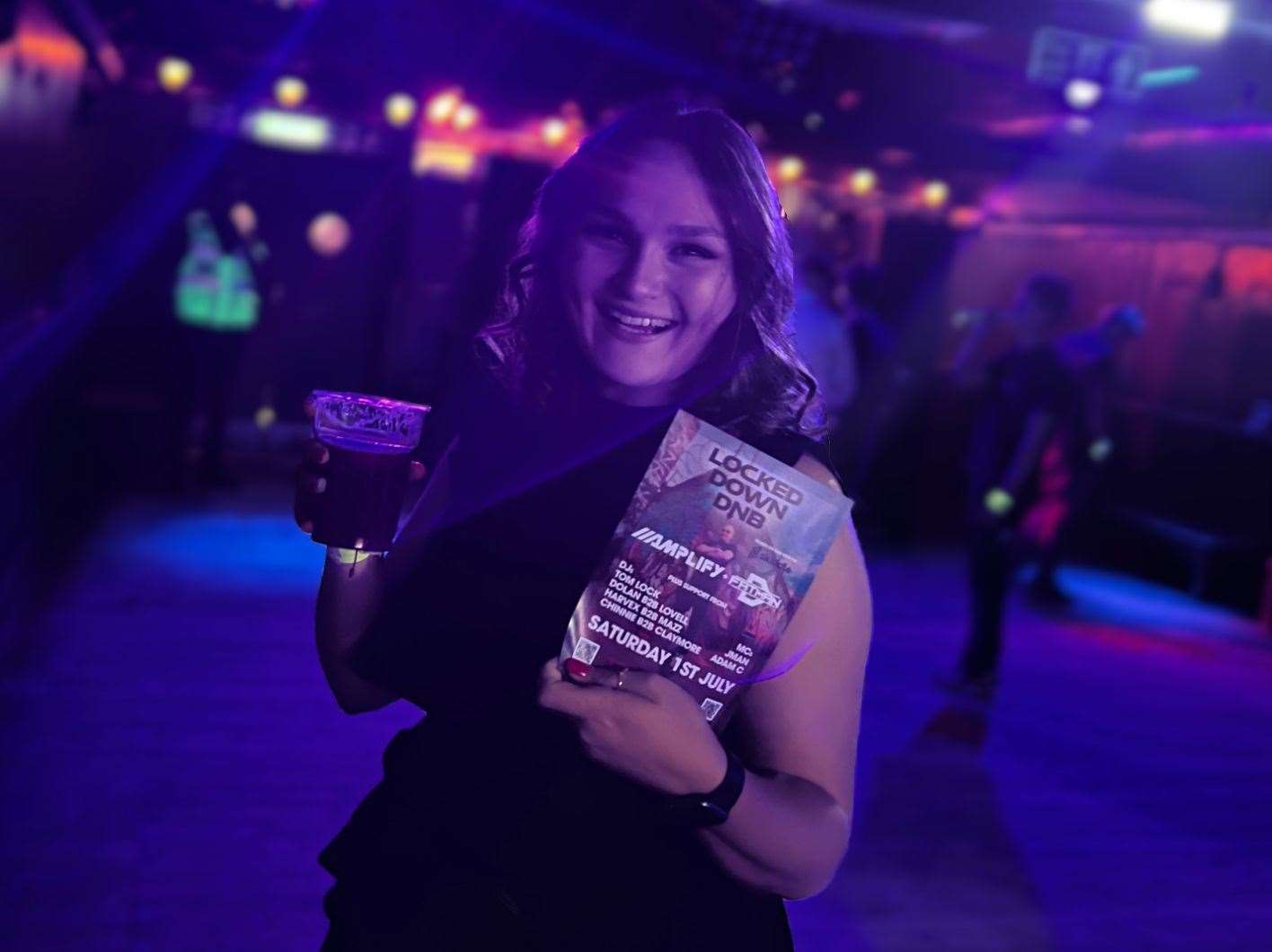 Reporter Megan Carr with the Locked Down drum and bass event flyer. Picture: Megan Carr