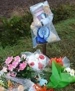 Floral tributes left at the spot, accompanied by a picture of Kirsty. Photograph: BARRY GOODWIN