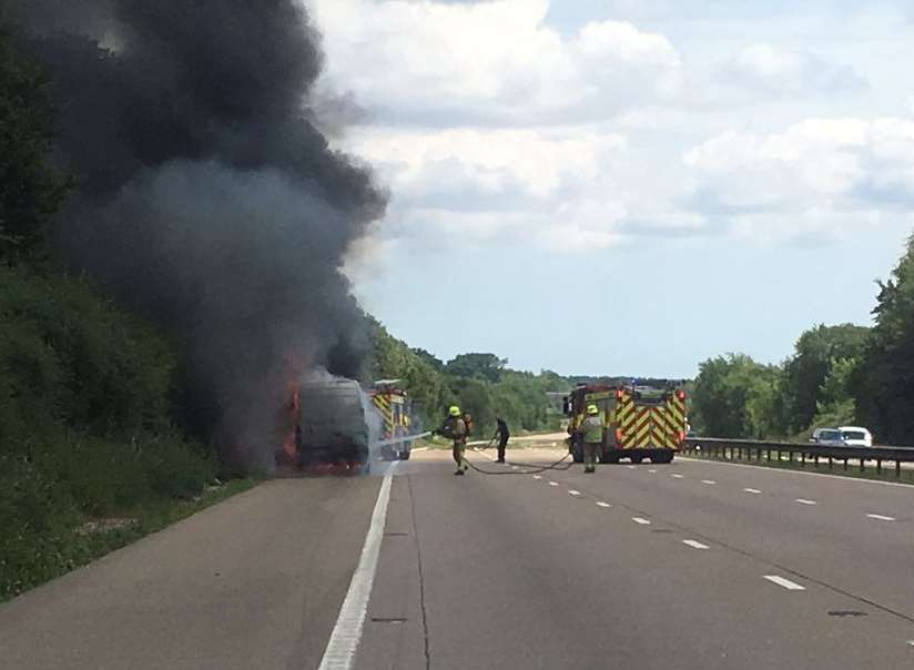 Fire fighters tackle the blaze. Picture: @kentpoliceroads