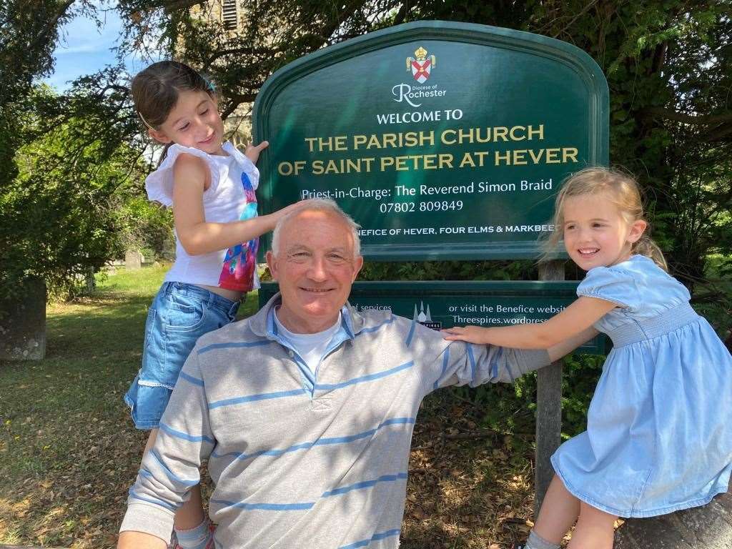 Rev Simon Braid of the Three Spires Benefice with his granddaughters
