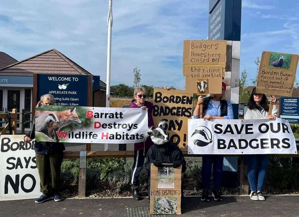 Members of Borden Wildlife Group protest outside developers Barratt David Wilson Homes sales suite in Wises Lane, Borden