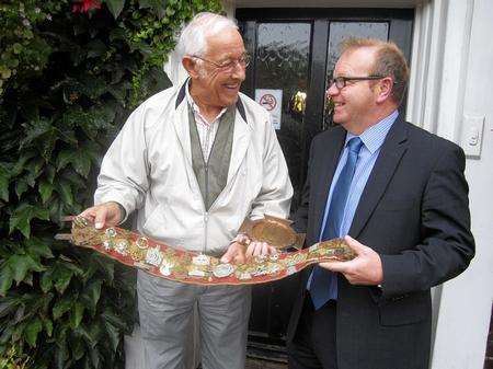 Dave Lake, left shows the military belt to Clive Attrell outside the valuation at the Star Inn, Matfield