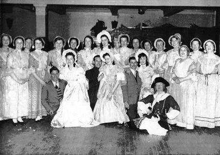 The Pirates of Panzance performed in 1954. Ann Lennard is sitting on her fellow cast member's knee on the right