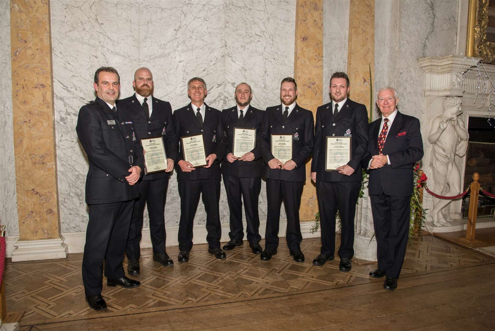 Ch Supt Adrian Futers (left) with the Gravesham Community Policing Team and awards ceremony guest of honour, former area commander Ken Tappenden