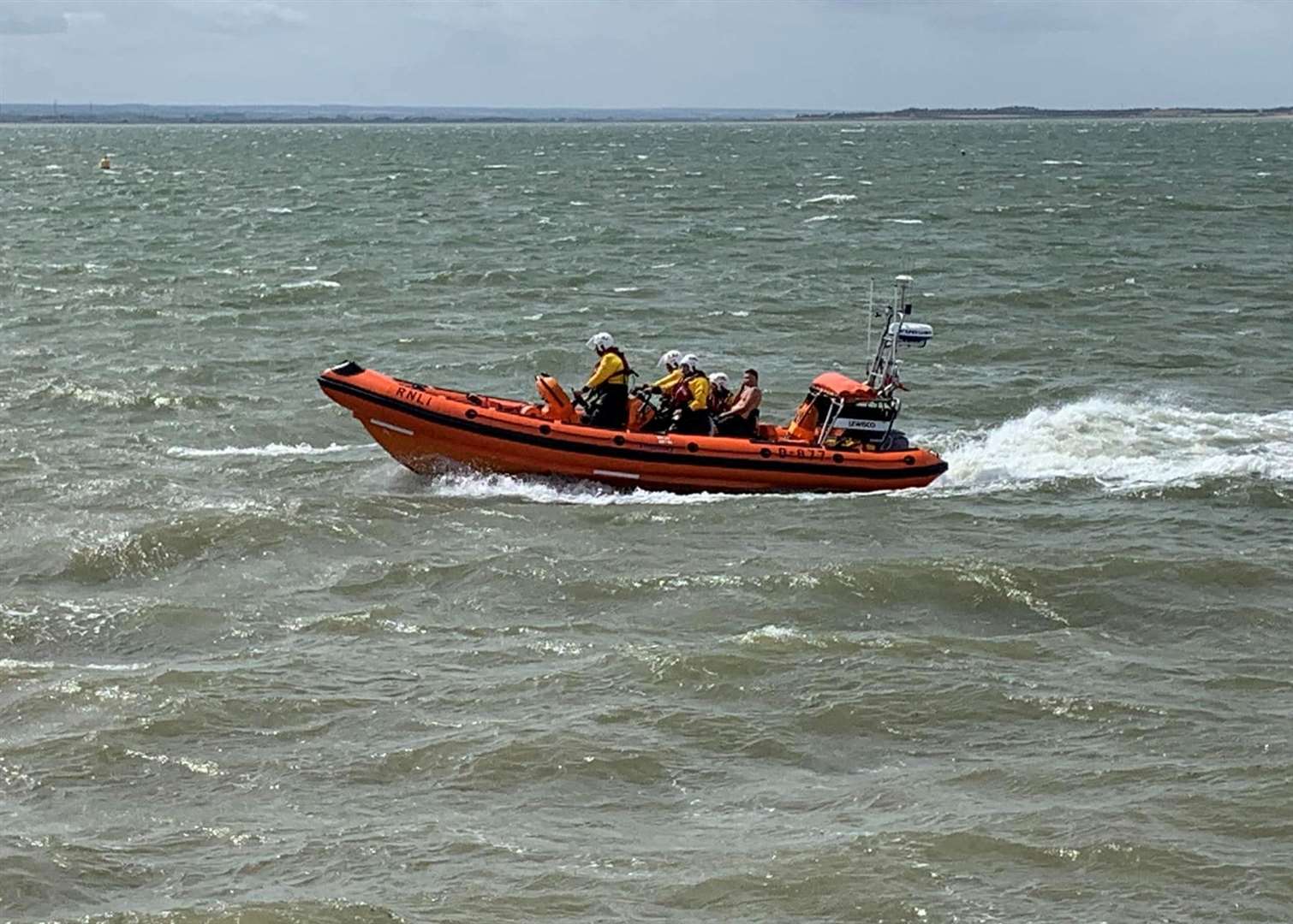 Crews rescued five people, including two children, after a boat's engine failed. Picture: RNLI