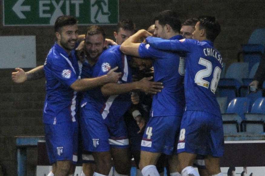 Leon Legge and team-mates celebrate the first of the defender's two goals against Leyton Orient Picture: Barry Goodwin