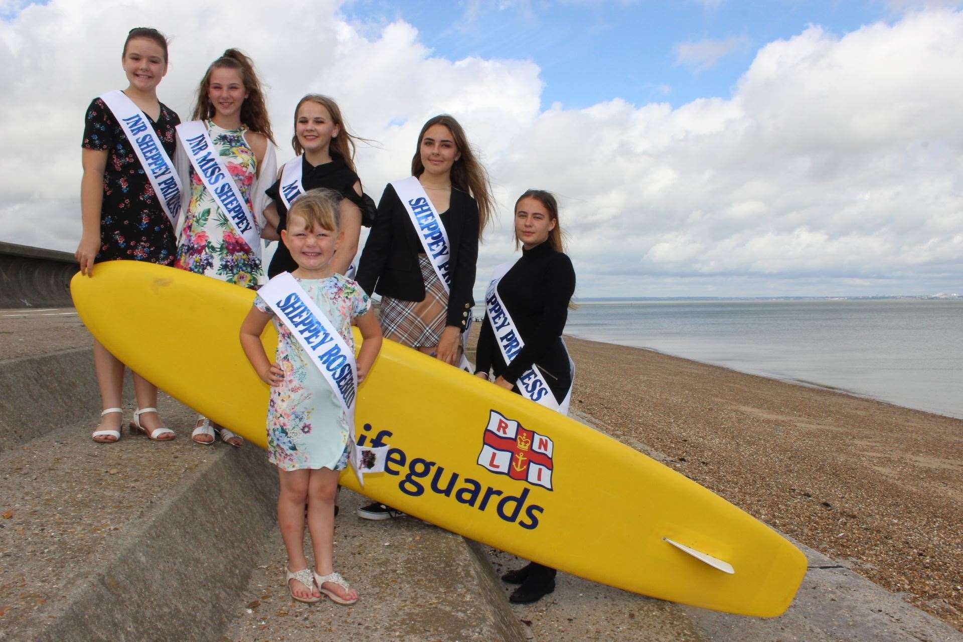 Making a splash: Sheppey carnival girls on the beach preparing for their big parade on Saturday. From the left, Lois Kidd, 10, Keira Collins-Kiazia, 13, carnival queen Melody Jackson, 15, Darcey Kidd, 14, and Paige Heaton, 14, with Sheppey Rosebud Evie Bowes, 5, in the front. Picture: John Nurden (15016567)