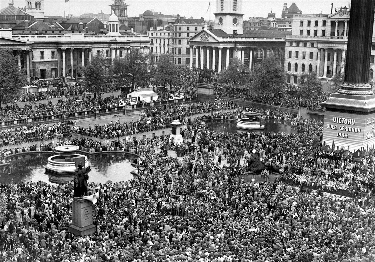 Huge crowds gathered in Trafalgar Square on May 8, 1945, to celebrate Victory in Europe Day (PA)