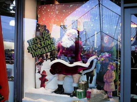Santa in the window of the Ted Baker store at the Ashford Designer Outlet Centre