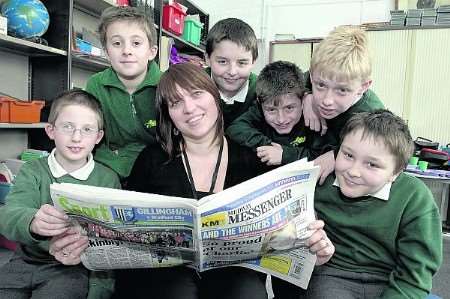 Medway Messenger reporter Hayley Robinson with boys talking about the paper.