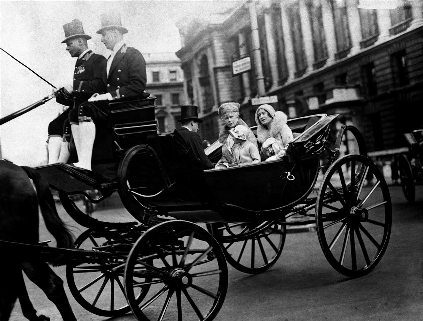 Queen Mary, Princess Elizabeth and the Duchess of York travel to the Trooping of the Colour celebrations in 1931 (PA)