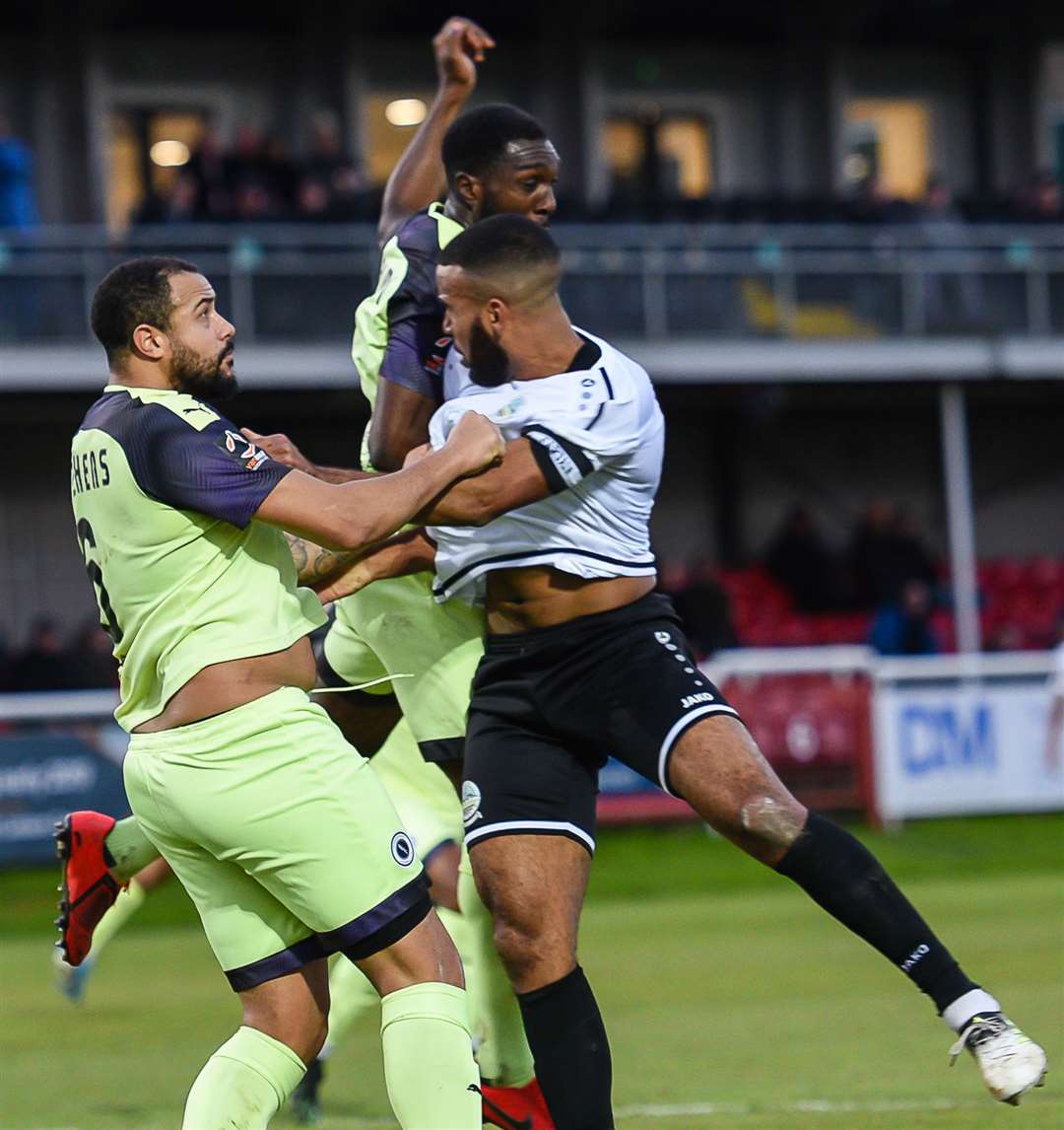 Dover 's Kevin Lokko finds his path blocked by Boreham Wood at Crabble on Saturday Picture: Alan Langley