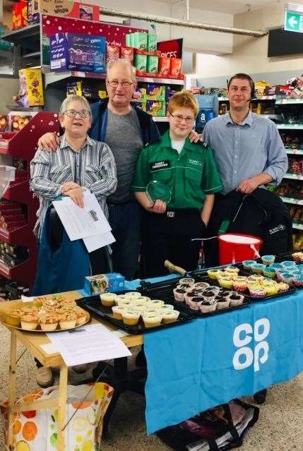 Mr Walsh and Logan at a fundraising cake sale at the River Co-op with store manager Simon Taylor. Also there is Linda Beverton of the River Methodist Church and cake sale organiser. Picture: St John Ambulance