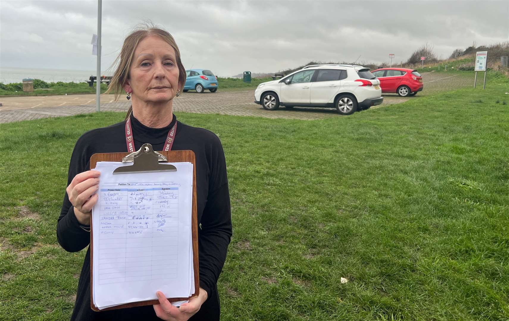 Marilyn Ward with the petition by the Little Oyster car park. Picture: Megan Carr