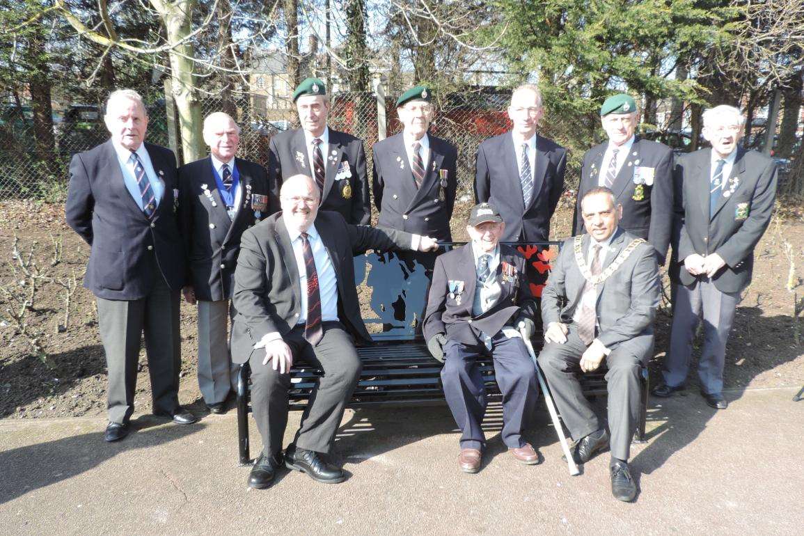 War veterans stop for a picture with the bench alongside council leader Jeremy Kite and town mayor Avtar Sandhu