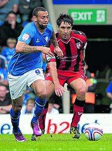 Garry Richards fights for possession at Chesterfield.