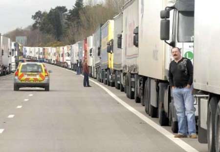 Truckers wait outside their vehicles as freight traffic queues at junction 9 on Thursday. Picture: GRANT FALVEY