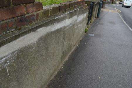 Skid marks and a scraped wall where Alex Osborn was struck by a van