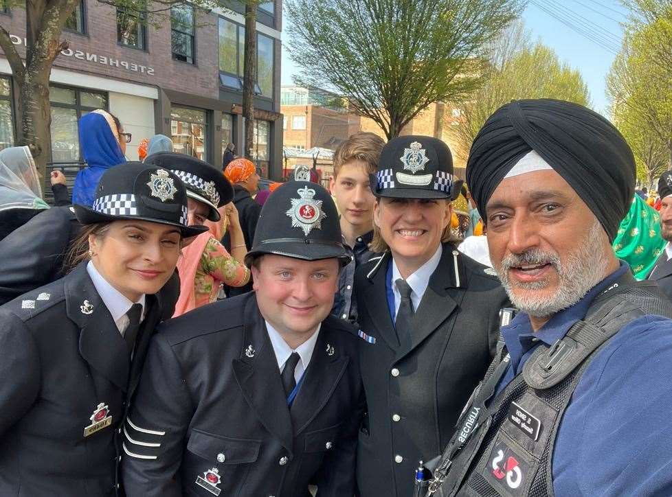 Northfleet resident Andy Singh is joined by police officers as the celebrations. Photo: Andy Singh