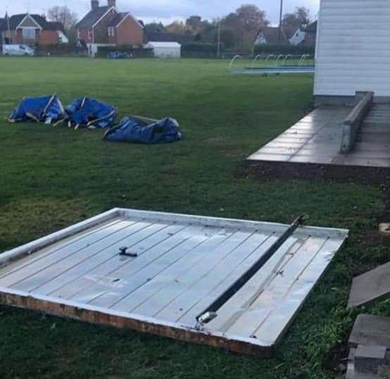 The garage's door was left lying on the ground after the incident. Picture: Kennington Cricket Club