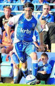 Gillingham defender John Nutter in action against Norwich