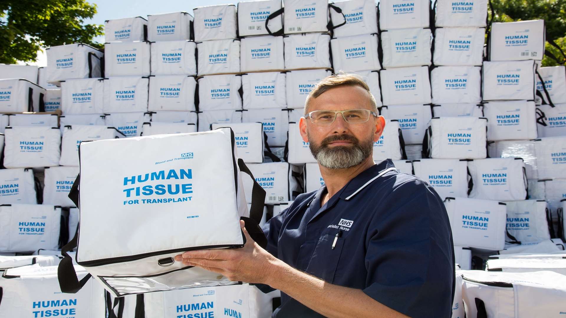 Blood and transplant nurse, Marc Coe, with empty transplant boxes showing missed opportunities